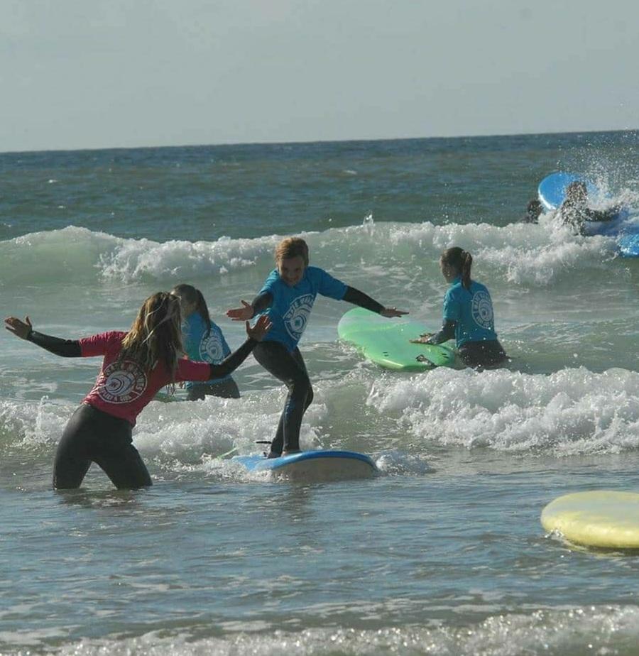 kids surf lessons in newquay cornwall with pro surfer and surf coach tehillah mcguinness